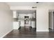 Bright kitchen with stainless steel appliances, white cabinets, and gray wood-look flooring at 7920 E Camelback Rd # 110, Scottsdale, AZ 85251