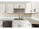 Close-up of the kitchen with stainless steel appliances and a large sink at 7920 E Camelback Rd # 110, Scottsdale, AZ 85251