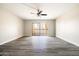 Spacious living room with sliding glass doors leading to a balcony at 7920 E Camelback Rd # 110, Scottsdale, AZ 85251