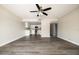 Spacious living room with gray flooring looking to the open kitchen area at 7920 E Camelback Rd # 110, Scottsdale, AZ 85251