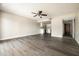 Spacious living room with ceiling fan and view of open kitchen at 7920 E Camelback Rd # 110, Scottsdale, AZ 85251