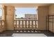 Open-air balcony with concrete railing overlooking manicured green lawn and apartment building at 7920 E Camelback Rd # 110, Scottsdale, AZ 85251