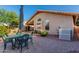 Inviting backyard with patio, mature landscaping, and comfortable outdoor seating at 7940 W Taro Ln, Glendale, AZ 85308