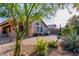 Lovely backyard with brick pavers, desert landscaping, and ample space for outdoor living at 7940 W Taro Ln, Glendale, AZ 85308