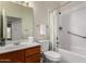 Cozy bathroom with tiled shower, neutral colors, and modern fixtures at 7940 W Taro Ln, Glendale, AZ 85308