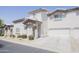 Inviting two-story home with stucco siding, well-kept landscaping, and an attached two-car garage at 7978 W Zoe Ella Way, Peoria, AZ 85382