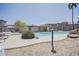 This luxurious community pool features a spa, plenty of lounging space, and charming desert landscaping for a relaxing experience at 7978 W Zoe Ella Way, Peoria, AZ 85382
