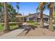 Charming single-story home with a well-maintained front yard and inviting walkway framed by mature palm trees at 8036 N 17Th Dr, Phoenix, AZ 85021
