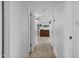 Hallway featuring wood-look floors leading into a living room at 8036 N 17Th Dr, Phoenix, AZ 85021