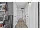 Hallway with wood-look floors, leading to the bedrooms and other living spaces at 8036 N 17Th Dr, Phoenix, AZ 85021
