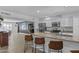 Open concept kitchen with stainless steel appliances, granite counters and breakfast bar at 8036 N 17Th Dr, Phoenix, AZ 85021