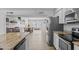 Well-lit kitchen showcasing granite countertops, stainless steel appliances, and an open layout to the living area at 8036 N 17Th Dr, Phoenix, AZ 85021
