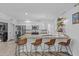 Spacious kitchen features a breakfast bar with seating, granite countertops, and stainless steel appliances at 8036 N 17Th Dr, Phoenix, AZ 85021