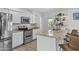 Modern kitchen featuring white cabinetry, granite countertops, and stainless-steel appliances, creating a clean and functional space at 8036 N 17Th Dr, Phoenix, AZ 85021