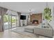 Cozy living room with brick fireplace and sliding glass doors to the backyard at 8036 N 17Th Dr, Phoenix, AZ 85021