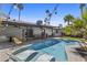 Inviting outdoor space featuring a refreshing swimming pool, patio, and lush landscaping at 8036 N 17Th Dr, Phoenix, AZ 85021