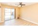 Bright bedroom features wood look floors, fresh paint and a sliding door to the outdoor patio at 8616 E Diamond St, Scottsdale, AZ 85257