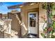 Inviting front entryway featuring a white door, tiled floor, and lush bougainvillea at 8616 E Diamond St, Scottsdale, AZ 85257