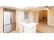 Bright kitchen features a modern island with quartz countertops, new stainless steel appliances, and a convenient laundry closet at 8616 E Diamond St, Scottsdale, AZ 85257