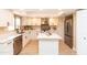 Modern kitchen with white cabinets, stainless steel appliances, and a functional center island at 8616 E Diamond St, Scottsdale, AZ 85257