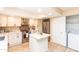 Well-appointed kitchen with white cabinets, stainless steel appliances, and a convenient center island at 8616 E Diamond St, Scottsdale, AZ 85257