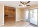 Open living room with wood look floors and sliding glass doors to the outdoor space at 8616 E Diamond St, Scottsdale, AZ 85257