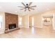 Open living room with hardwood floors, stone fireplace, and recessed lighting at 8616 E Diamond St, Scottsdale, AZ 85257