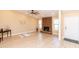 Bright and airy living room featuring wood flooring and a charming stone fireplace at 8616 E Diamond St, Scottsdale, AZ 85257