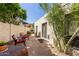 Cozy back patio featuring brick pavers, desert landscaping, comfortable seating, and a peaceful atmosphere at 9012 S 47Th Pl, Phoenix, AZ 85044