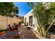 Relaxing backyard with a patio, lush greenery, and mature trees for privacy at 9012 S 47Th Pl, Phoenix, AZ 85044