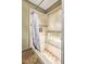 Shower area featuring decorative tile, a built-in niche, and a neutral color palette at 9012 S 47Th Pl, Phoenix, AZ 85044