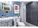 Stylish bathroom with a unique sink, modern fixtures, and a beautifully tiled shower at 9012 S 47Th Pl, Phoenix, AZ 85044