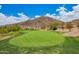 Well-manicured golf course with lush green fairway and serene mountain views, perfect for golf enthusiasts at 9012 S 47Th Pl, Phoenix, AZ 85044