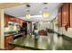Open kitchen with natural stone counters and a convenient island, offering lots of space at 9012 S 47Th Pl, Phoenix, AZ 85044