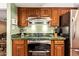 Well-equipped kitchen with custom cabinetry, granite countertops, and stainless steel appliances at 9012 S 47Th Pl, Phoenix, AZ 85044
