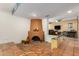 Open living space with a focal fireplace and step-down to a cozy sitting area at 9012 S 47Th Pl, Phoenix, AZ 85044