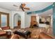 Spacious living room with fireplace, arched doorways and traditional tile flooring at 9012 S 47Th Pl, Phoenix, AZ 85044