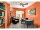 Inviting home office with a ceiling fan, natural light, and a modern desk at 9012 S 47Th Pl, Phoenix, AZ 85044