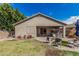 Expansive backyard featuring a covered patio, seating, and a well-maintained lawn at 9463 W Ross Ave, Peoria, AZ 85382