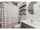 Updated bathroom with shiplap walls, floating shelves, and stylish fixtures at 9463 W Ross Ave, Peoria, AZ 85382