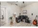 Bright bedroom features a ceiling fan, wood floors, and a desk at 9463 W Ross Ave, Peoria, AZ 85382