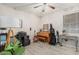 Bright bedroom with a ceiling fan, wood floors, and a music corner at 9463 W Ross Ave, Peoria, AZ 85382