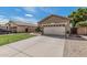 Lovely one-story home with two-car garage, wide driveway, desert landscaping, and easy maintenance yard at 9463 W Ross Ave, Peoria, AZ 85382