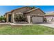 Welcoming entrance to a single-story home with desert landscaping, patio, and charming front door at 9463 W Ross Ave, Peoria, AZ 85382