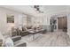 Cozy living room featuring a large sofa, modern decor, and ample natural light at 9463 W Ross Ave, Peoria, AZ 85382
