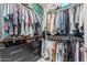 Spacious walk-in closet with extensive shelving and hanging storage for organized wardrobe solutions at 9463 W Ross Ave, Peoria, AZ 85382