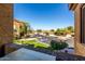 Scenic balcony view overlooking the parking area, trees and community landscape on a sunny day at 10136 E Southern Ave # 2064, Mesa, AZ 85209