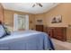 Comfortable bedroom with large bed, window, ceiling fan, and chest of drawers at 10136 E Southern Ave # 2064, Mesa, AZ 85209