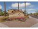Beautifully landscaped community sign with vibrant flowers and lush greenery at 10136 E Southern Ave # 2064, Mesa, AZ 85209