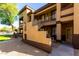 Inviting multi-story condo with well-maintained landscaping and convenient staircase access at 10136 E Southern Ave # 2064, Mesa, AZ 85209